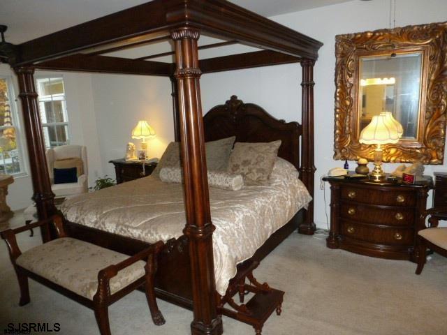11 Northampton Road, Unit FOUR SEASONS Galloway Township, NJ 08205 - Photo 8 of 13 a bedroom with a bed and a dresser