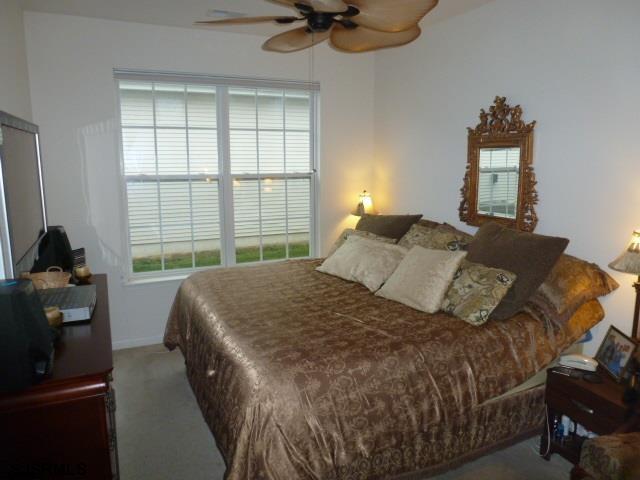 11 Northampton Road, Unit FOUR SEASONS Galloway Township, NJ 08205 - Photo 10 of 13 a bedroom with a bed and a window