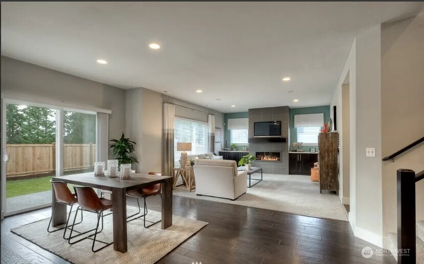 3606 200th Place Southeast Bothell, WA 98012 - Photo 11 of 28 a living room with furniture and a wooden floor