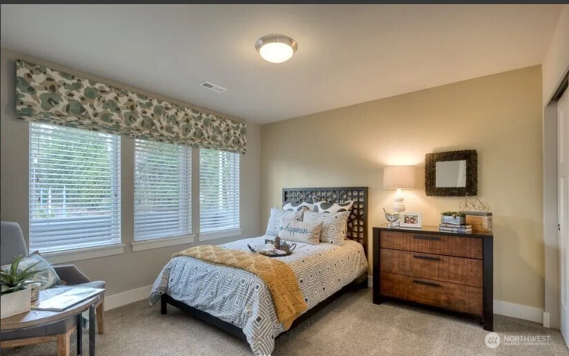 3606 200th Place Southeast Bothell, WA 98012 - Photo 13 of 28 a bedroom with a bed and a television