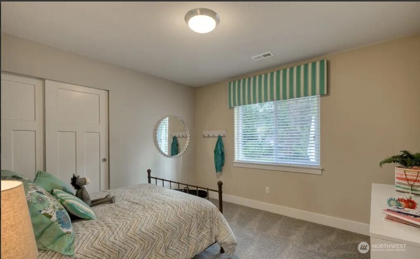 3606 200th Place Southeast Bothell, WA 98012 - Photo 15 of 28 a bedroom with a bed and a window