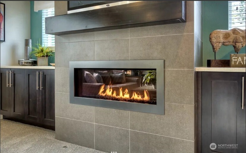 3606 200th Place Southeast Bothell, WA 98012 - Photo 22 of 28 a fireplace with wooden frame
