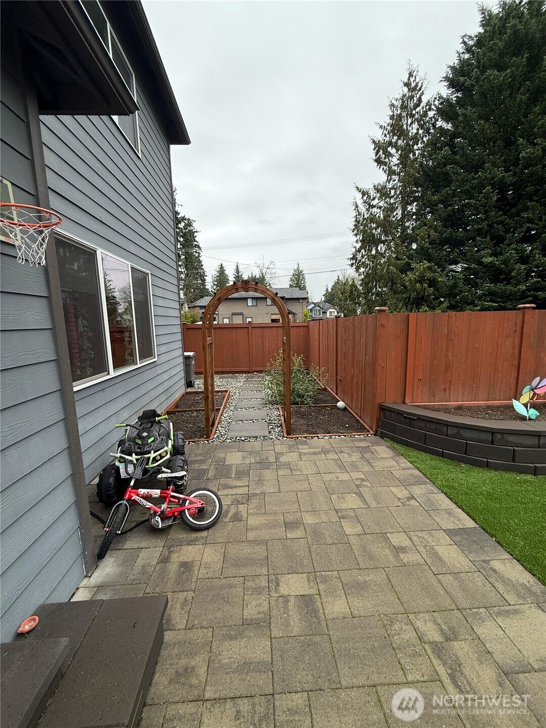 3606 200th Place Southeast Bothell, WA 98012 - Photo 27 of 28 a view of a patio with table and chairs and potted plants