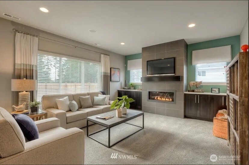 3606 200th Place Southeast Bothell, WA 98012 - Photo 3 of 28 a living room with furniture and a fireplace