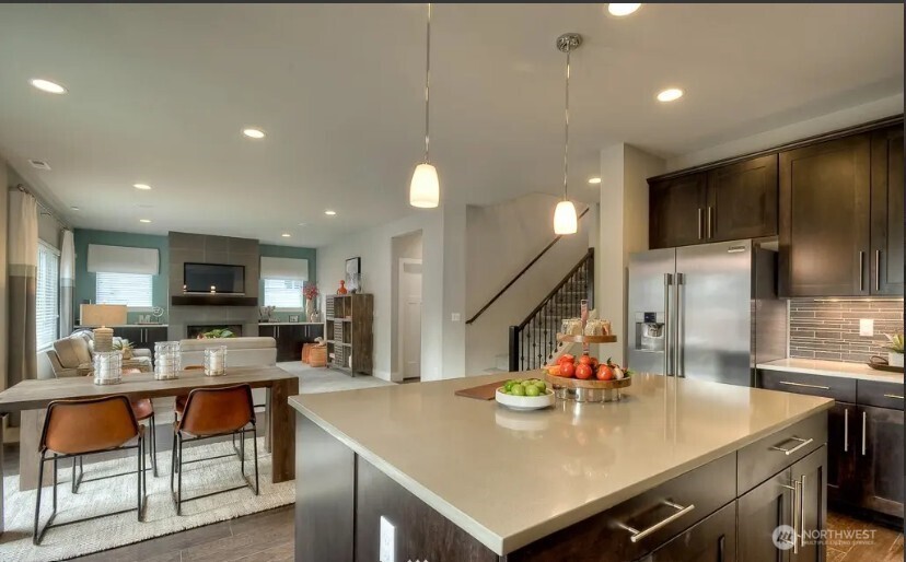 3606 200th Place Southeast Bothell, WA 98012 - Photo 9 of 28 a view of kitchen island a sink a table and chairs