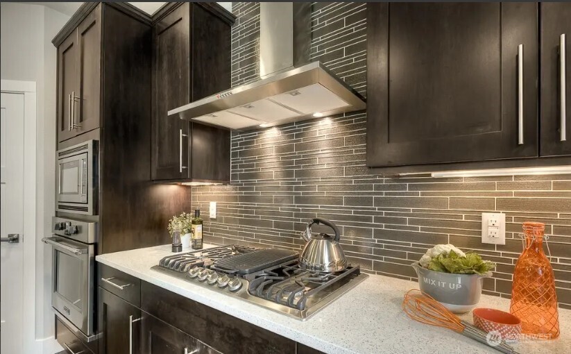 3606 200th Place Southeast Bothell, WA 98012 - Photo 10 of 28 a kitchen with a stove and a refrigerator