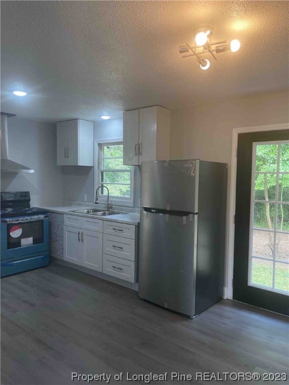 3100 Old Stage Road North Coats, NC 27521 - Photo 12 of 38 a kitchen with a refrigerator and a stove top oven