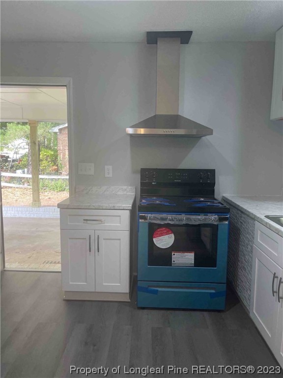 3100 Old Stage Road North Coats, NC 27521 - Photo 14 of 38 a kitchen with a stove and white cabinets