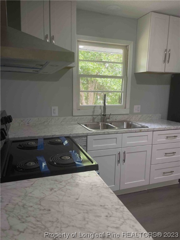 3100 Old Stage Road North Coats, NC 27521 - Photo 15 of 38 a kitchen with a sink and cabinets