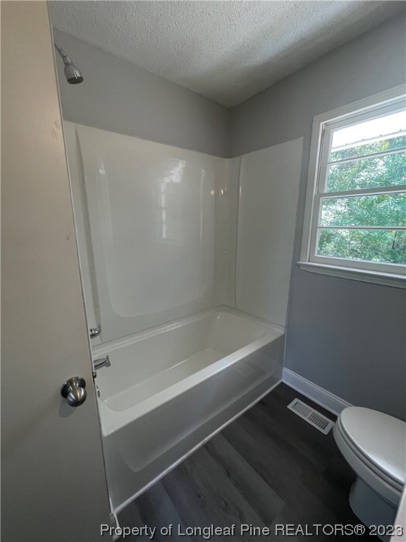 3100 Old Stage Road North Coats, NC 27521 - Photo 20 of 38 a bathroom with a bathtub and a toilet