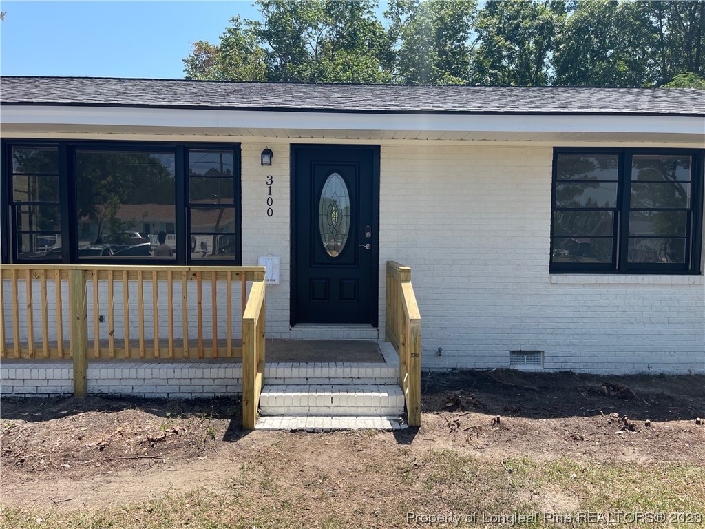3100 Old Stage Road North Coats, NC 27521 - Photo 2 of 38 a front view of a house with a yard