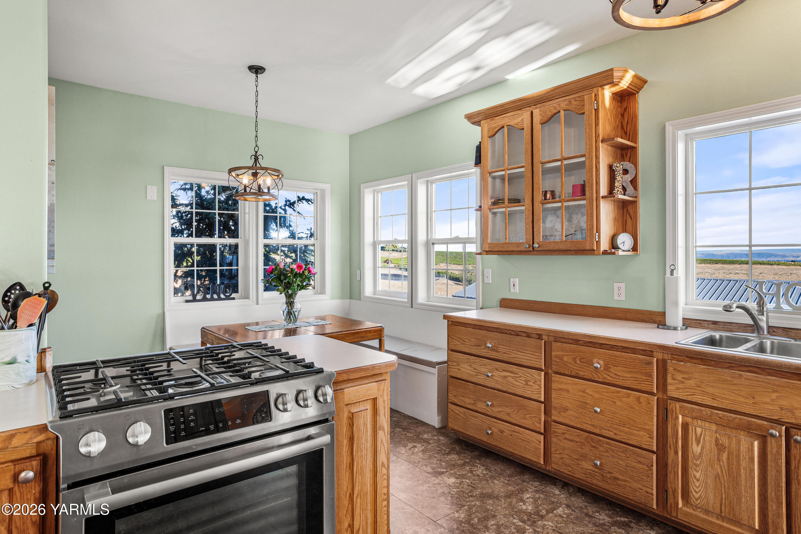 5060 Lombard Loop Road Zillah, WA 98953 - Photo 27 of 65 a kitchen with a stove a sink and a window