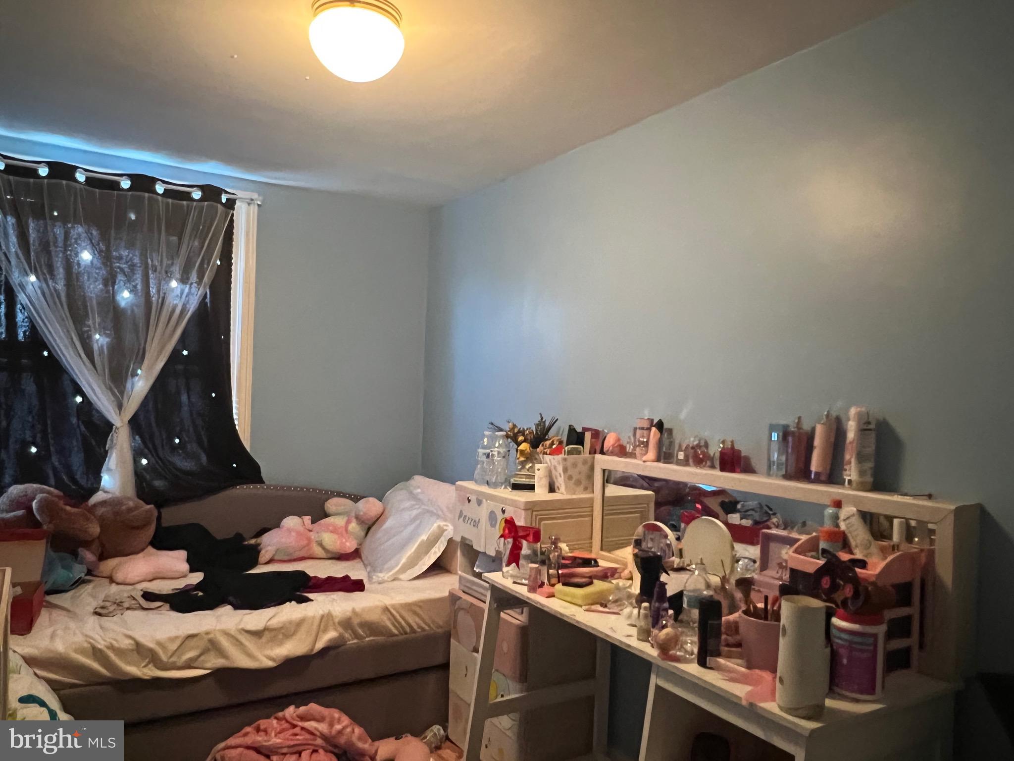 2818 Hellerman Street Philadelphia, PA 19149 - Photo 11 of 15 a bedroom with a bed and cabinets