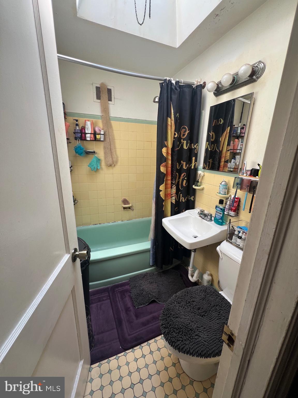 2818 Hellerman Street Philadelphia, PA 19149 - Photo 12 of 15 a bathroom with a sink toilet and a bathtub
