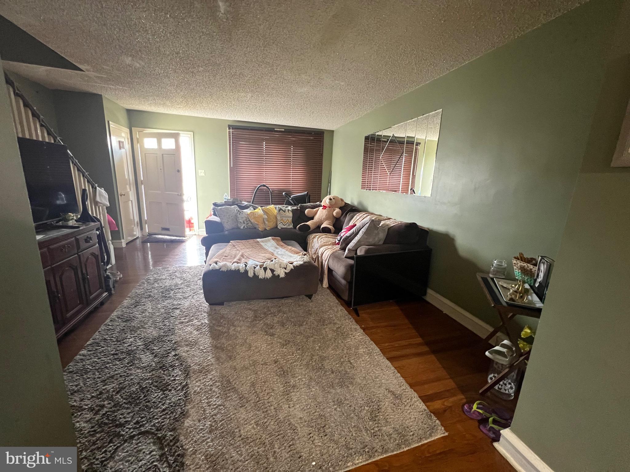 2818 Hellerman Street Philadelphia, PA 19149 - Photo 2 of 15 a living room with furniture and a flat screen tv