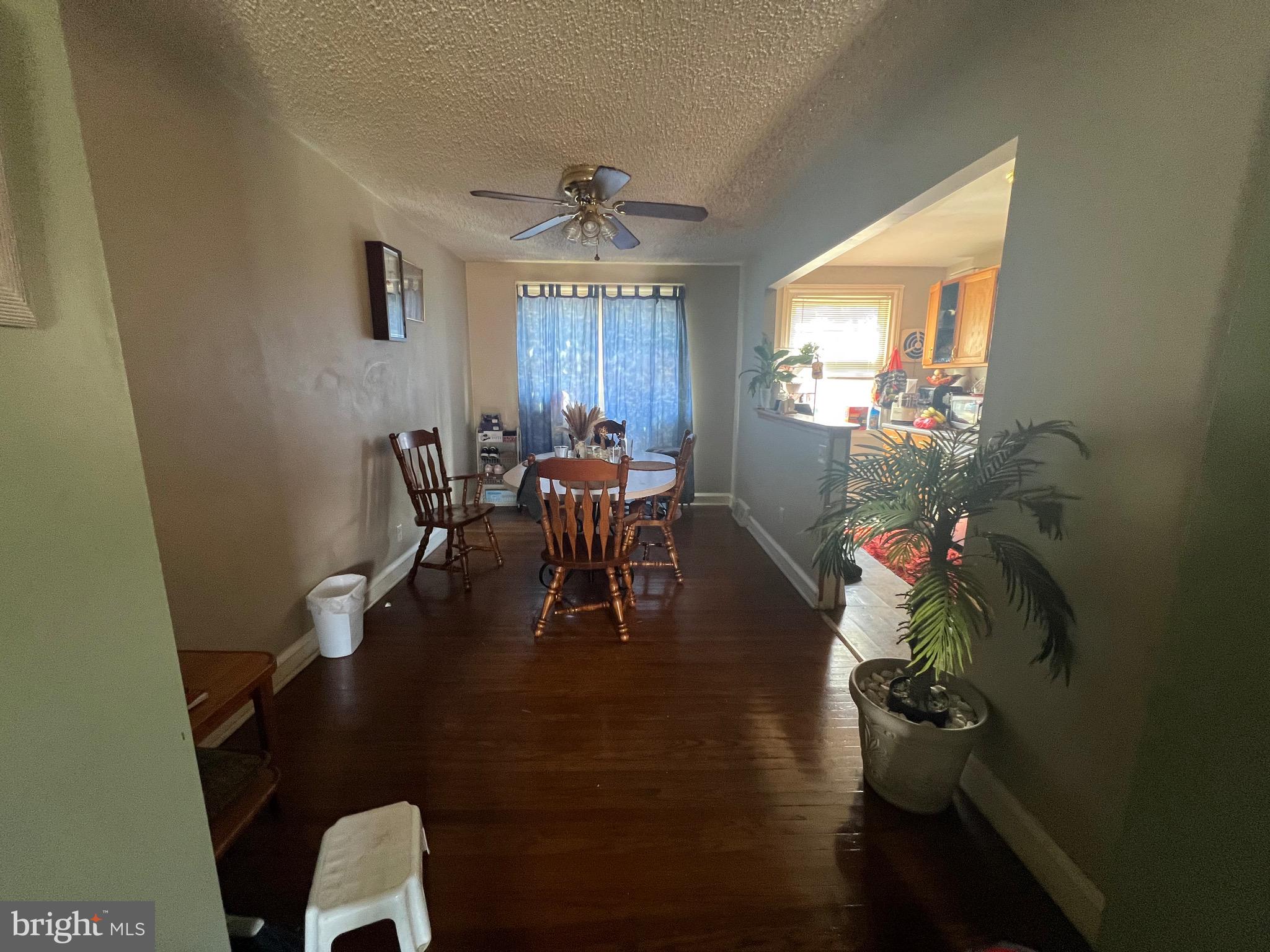 2818 Hellerman Street Philadelphia, PA 19149 - Photo 4 of 15 a dining room with furniture a chandelier and wooden floor