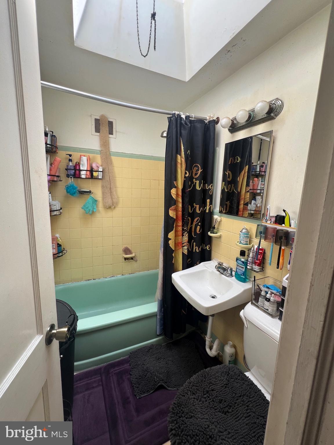 2818 Hellerman Street Philadelphia, PA 19149 - Photo 10 of 15 a bathroom with a sink a toilet and shower