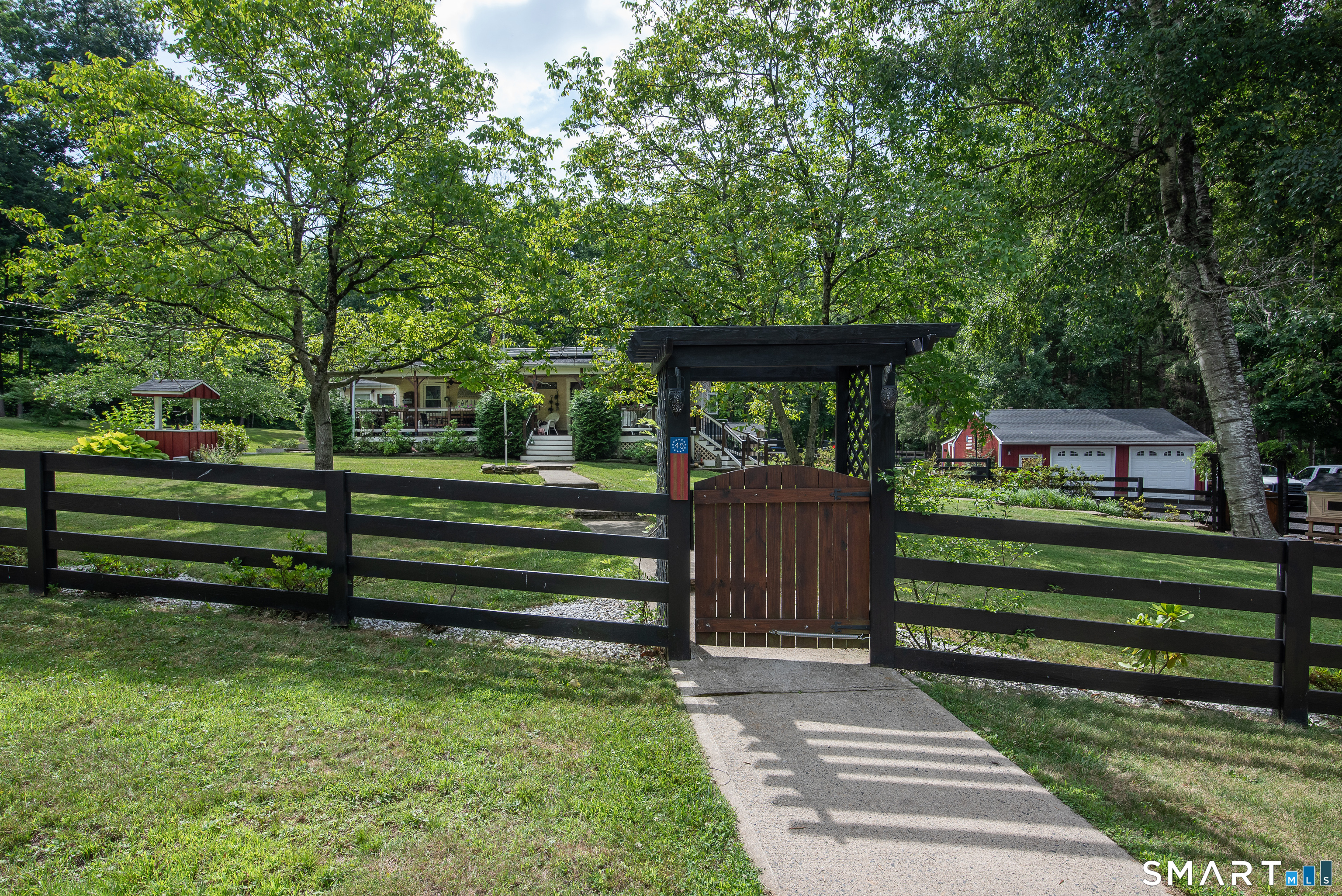 40 Seckar Road Willington, CT 06279 - Photo 3 of 37 The front gate welcomes you to a beautifully maintained property with so much to offer!