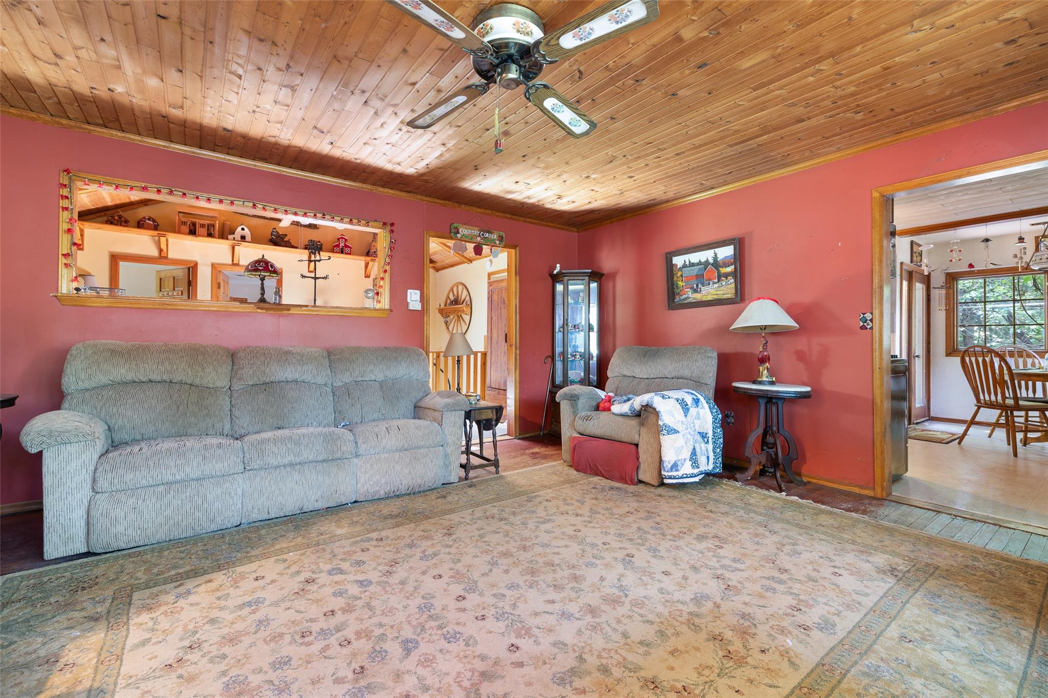 33 North Coleman Road Centereach, NY 11720 - Photo 12 of 40 Living area with ceiling fan, crown molding, and wooden ceiling