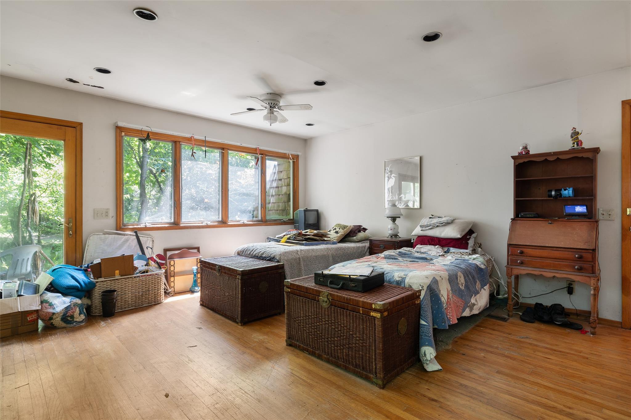 33 North Coleman Road Centereach, NY 11720 - Photo 20 of 40 Bedroom with hardwood / wood-style floors, multiple windows, and recessed lighting