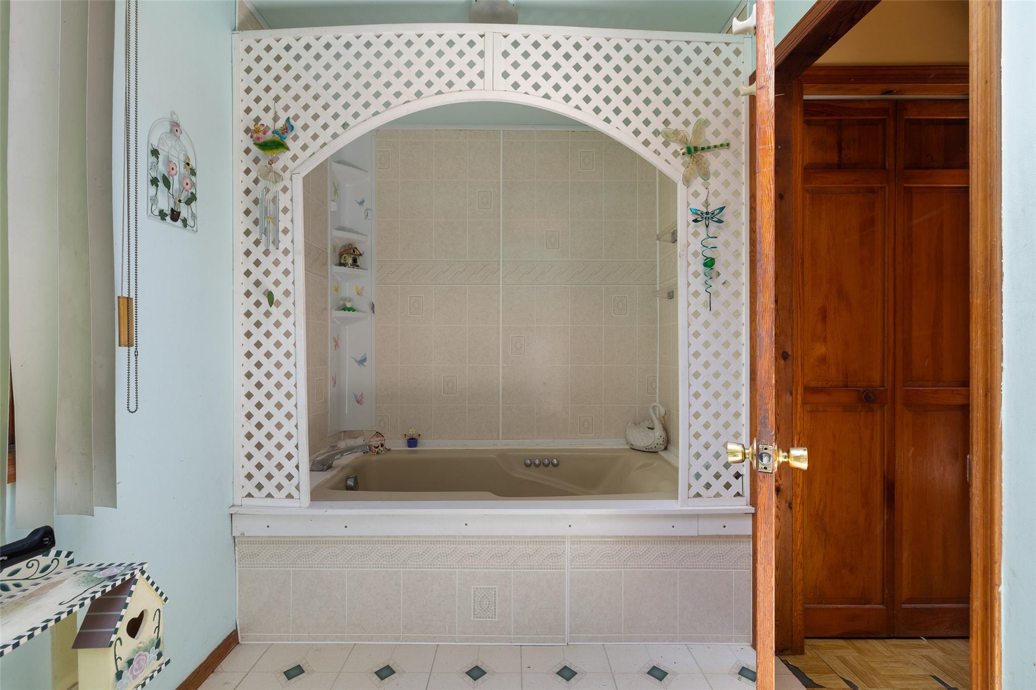 33 North Coleman Road Centereach, NY 11720 - Photo 23 of 40 Full bath featuring tiled bath and tile patterned floors