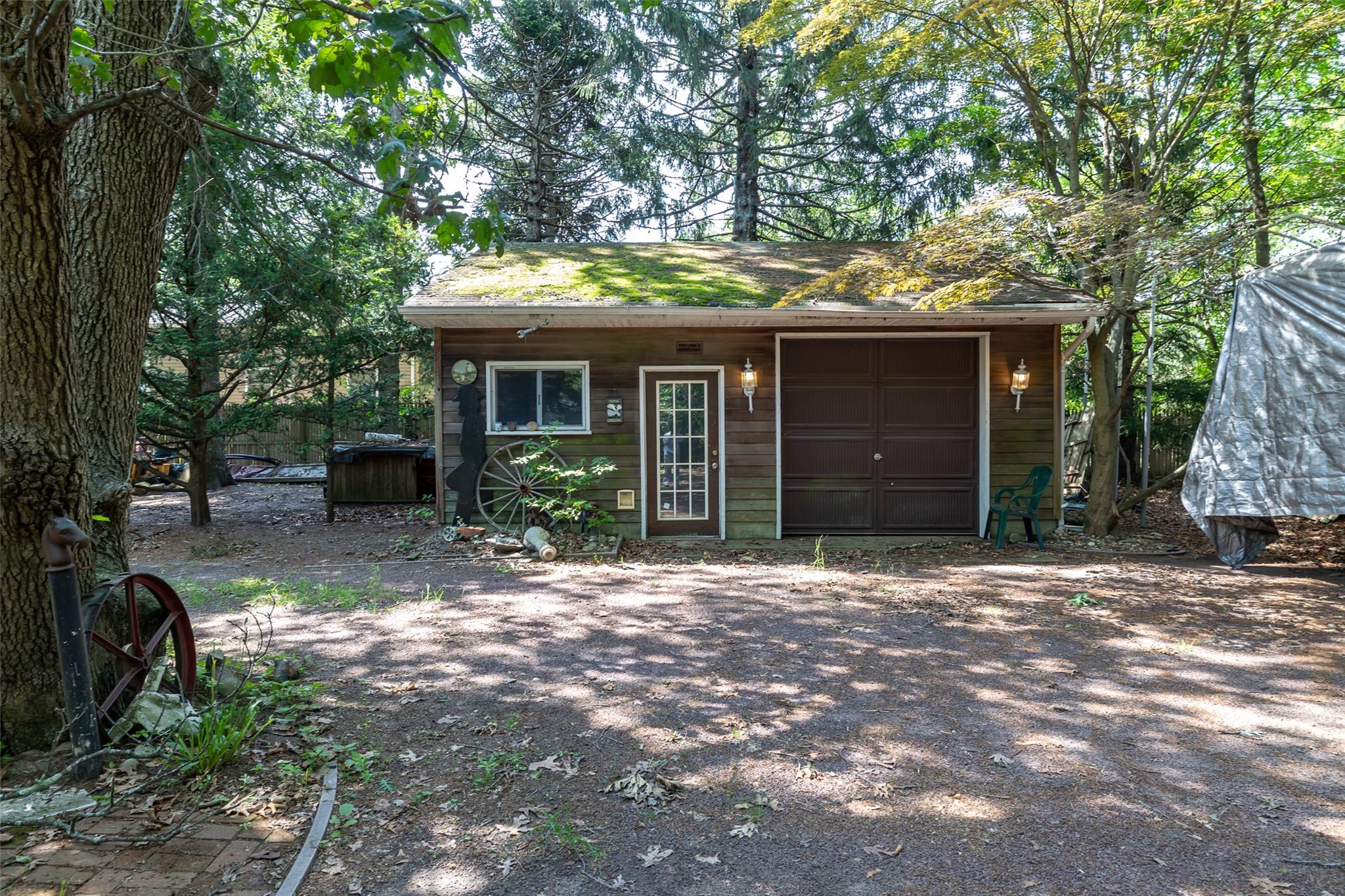 33 North Coleman Road Centereach, NY 11720 - Photo 28 of 40 View of front of home with an outdoor structure, a garage, and driveway
