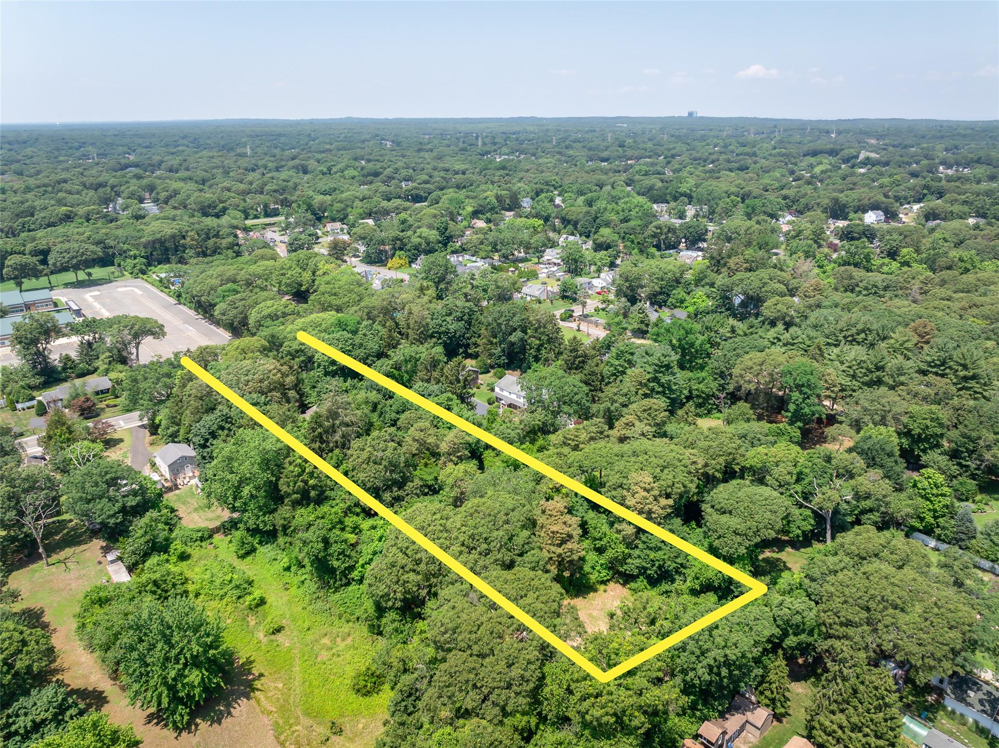 33 North Coleman Road Centereach, NY 11720 - Photo 40 of 40 View of property location with property parcel outlined and a heavily wooded area