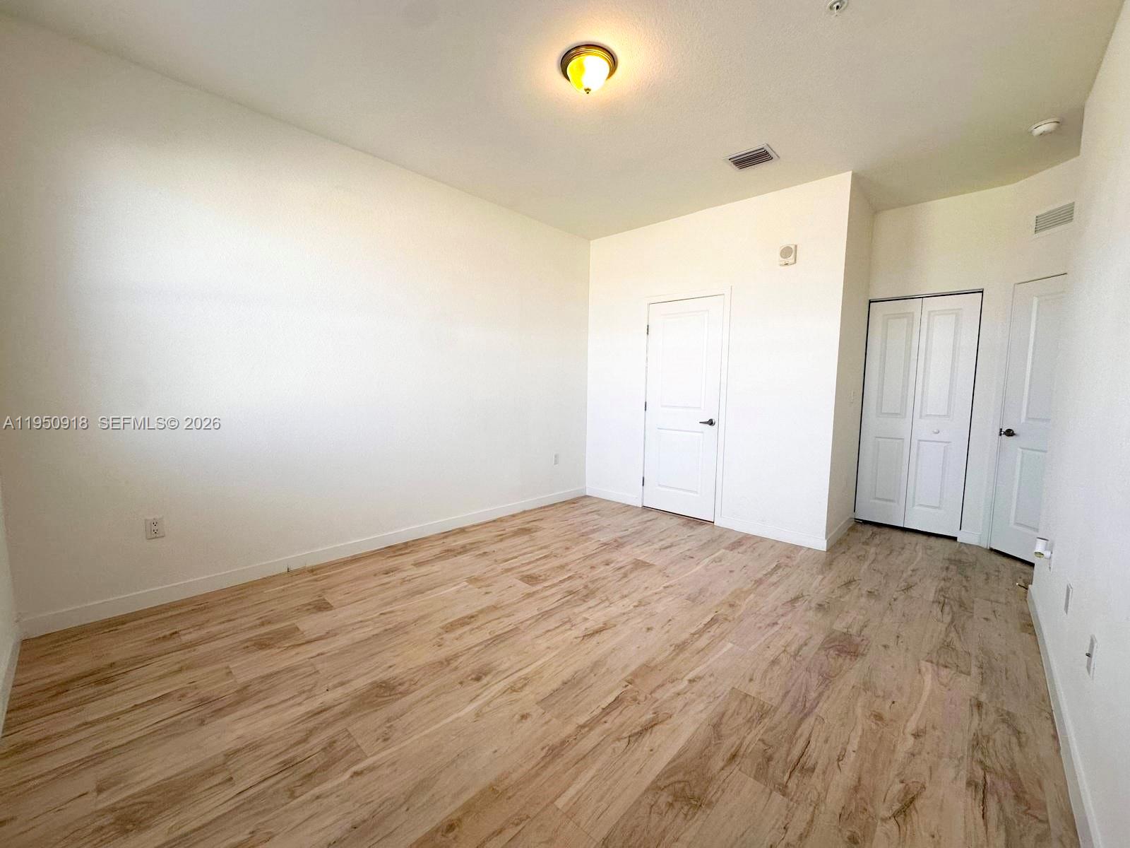 15540 Southwest 136th Street, Unit 204 Miami, FL 33196 - Photo 19 of 21 a view of empty room