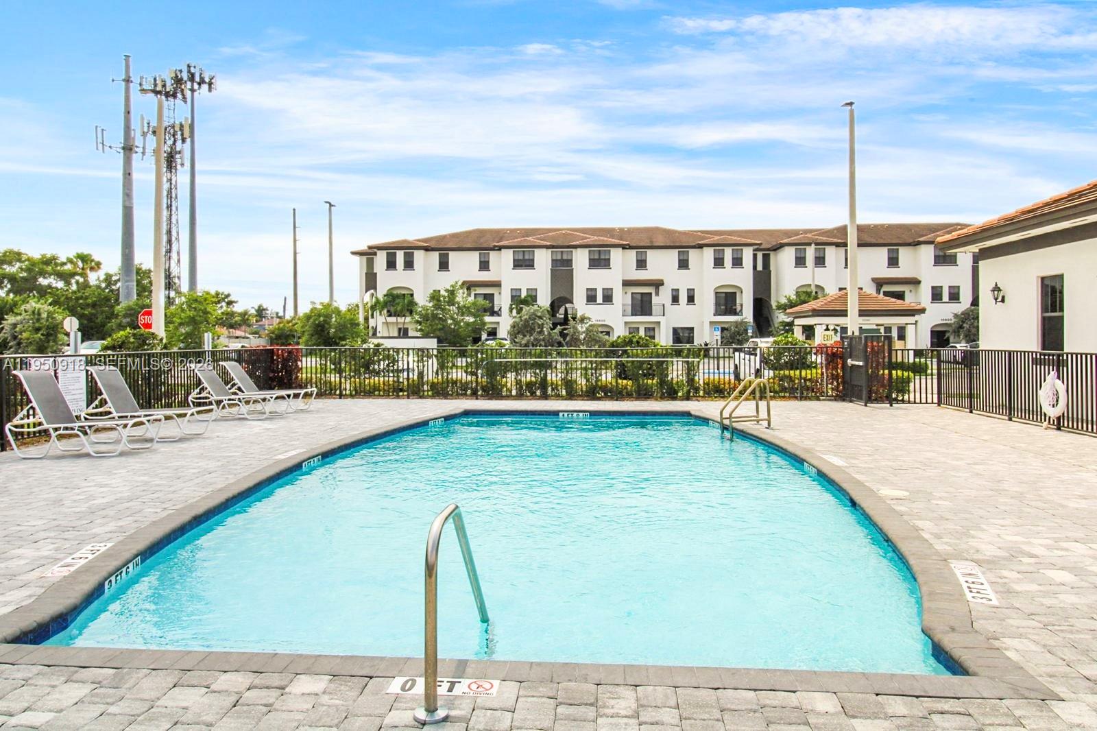 15540 Southwest 136th Street, Unit 204 Miami, FL 33196 - Photo 21 of 21 a view of swimming pool with outdoor seating
