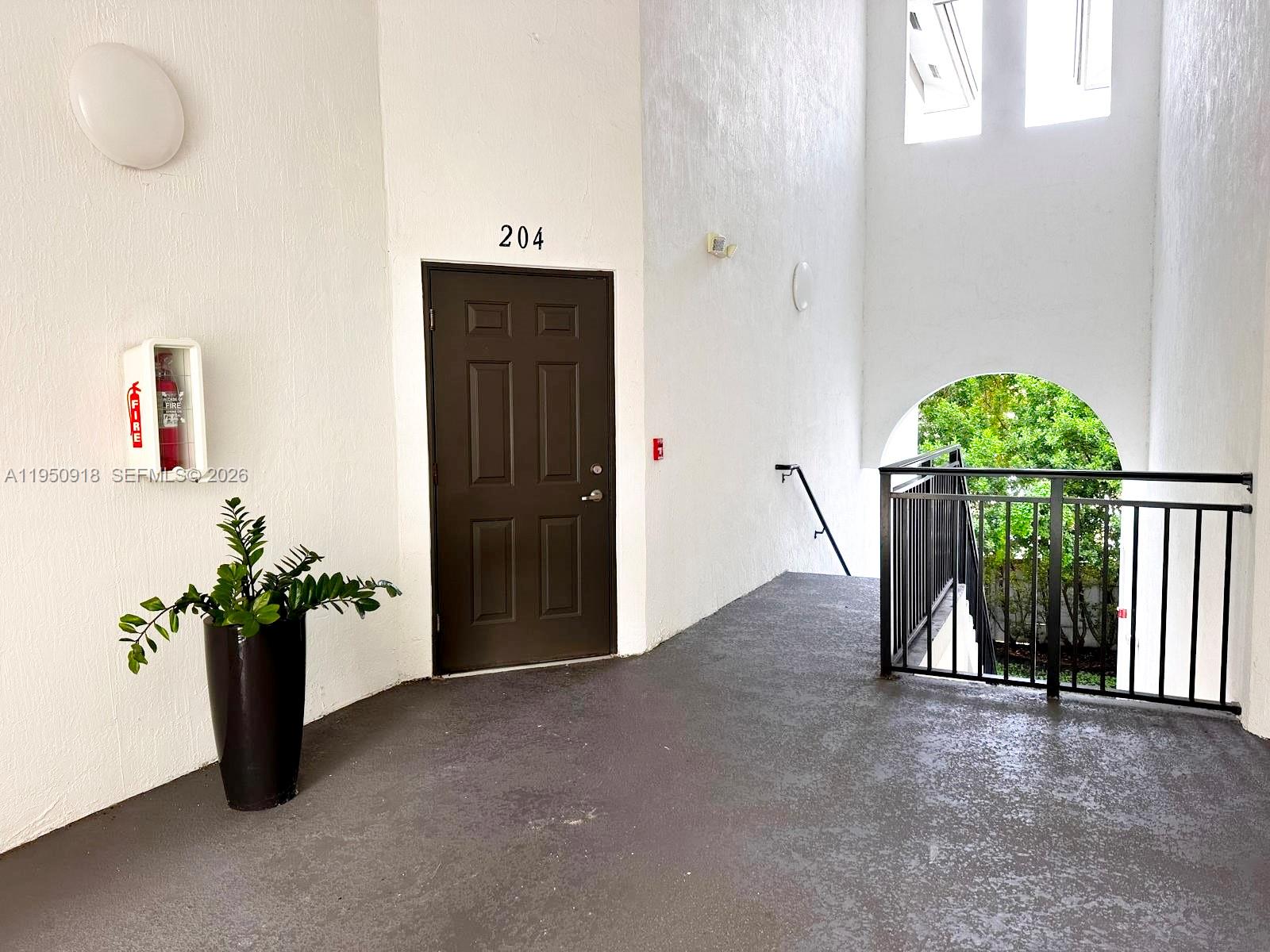 15540 Southwest 136th Street, Unit 204 Miami, FL 33196 - Photo 3 of 21 a view of entryway