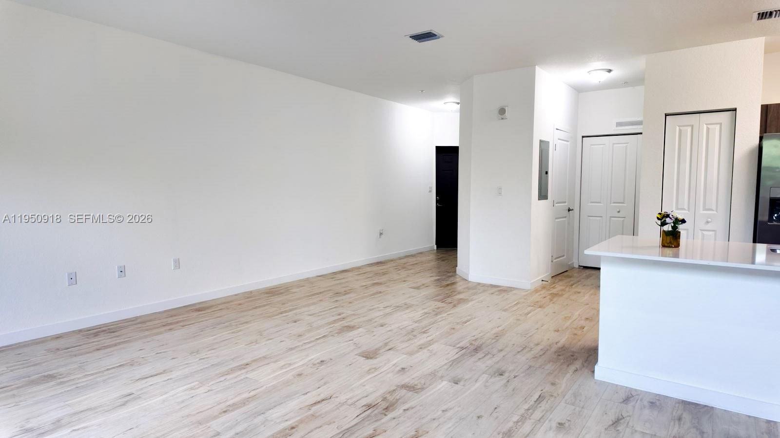 15540 Southwest 136th Street, Unit 204 Miami, FL 33196 - Photo 5 of 21 a view of a kitchen with wooden floor