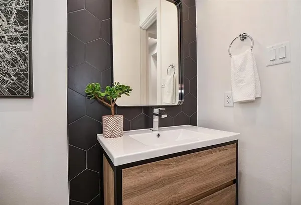 a bathroom with a sink and a mirror