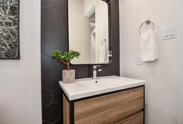 a bathroom with a sink and a mirror