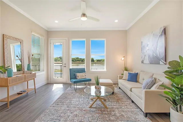 a living room with furniture and a large window