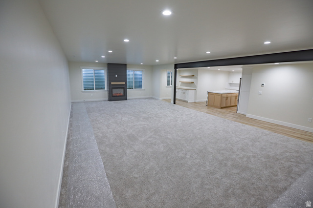 126 North 800 West Mapleton, UT 84664 - Photo 48 of 79 Unfurnished living room with recessed lighting, light colored carpet, and a large fireplace