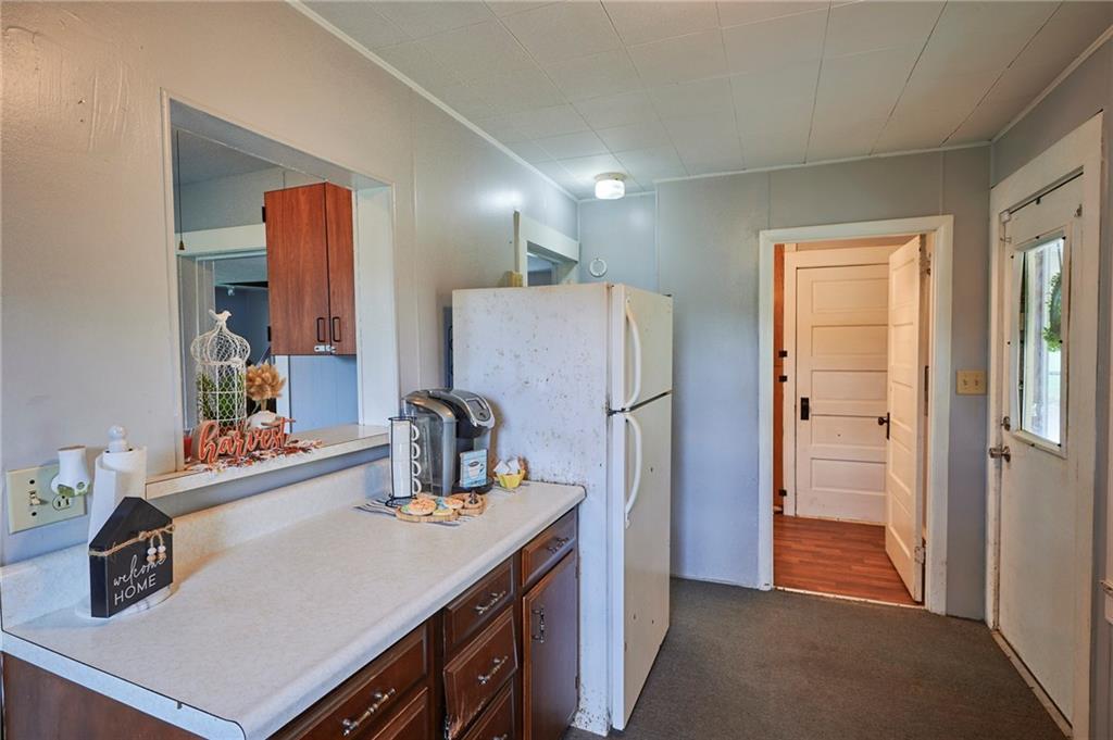 6559 Rte 119 Highway North Marion Center, PA 15759 - Photo 12 of 35 a kitchen with a refrigerator and a sink