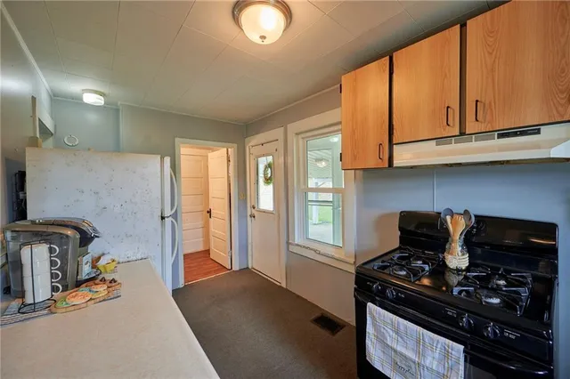 a kitchen with a stove and a microwave