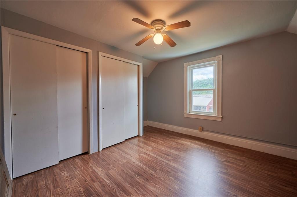 6559 Rte 119 Highway North Marion Center, PA 15759 - Photo 24 of 35 an empty room with wooden floor and windows