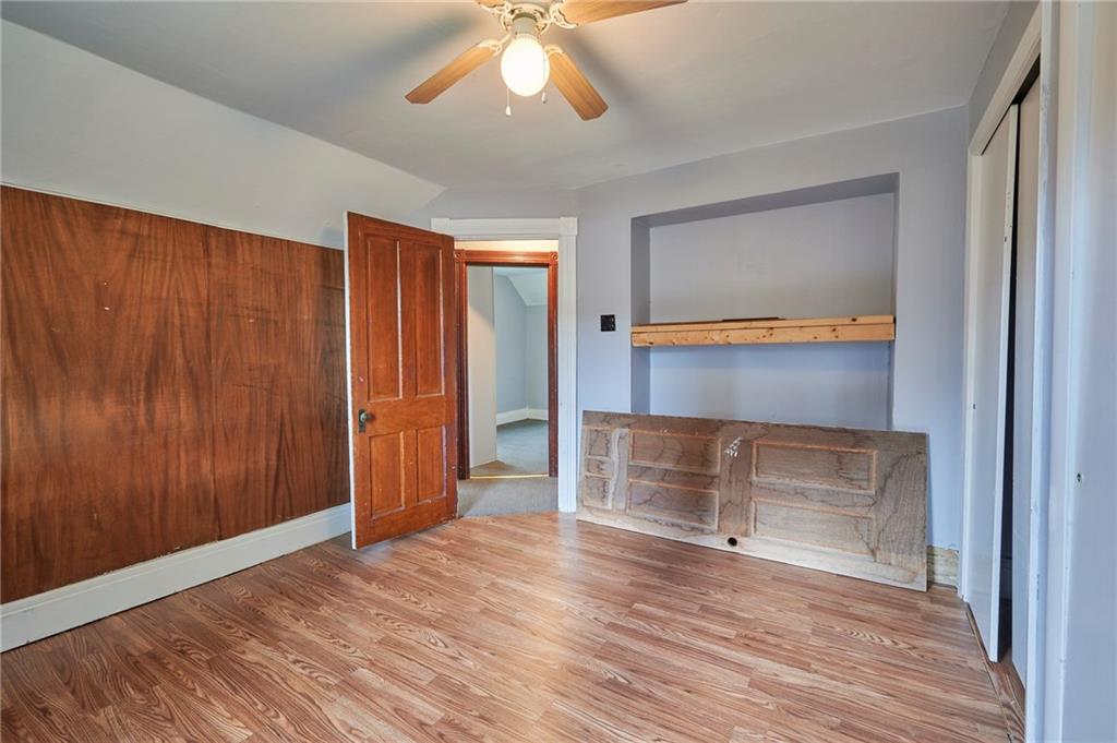6559 Rte 119 Highway North Marion Center, PA 15759 - Photo 25 of 35 an empty room with wooden floor cabinet and windows