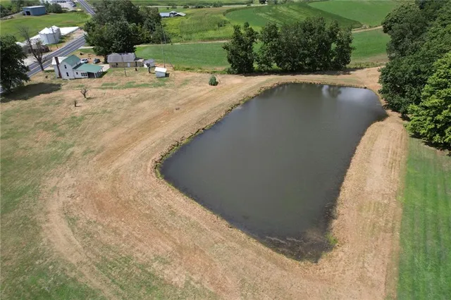 a view of a swimming pool with a yard