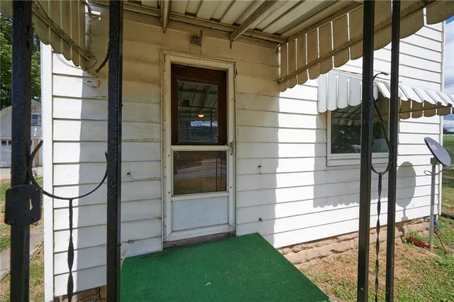 a view of a door and a window