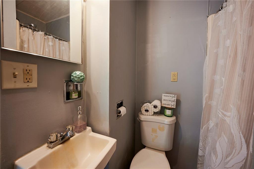 6559 Rte 119 Highway North Marion Center, PA 15759 - Photo 8 of 35 a white toilet sitting next to a bathroom sink