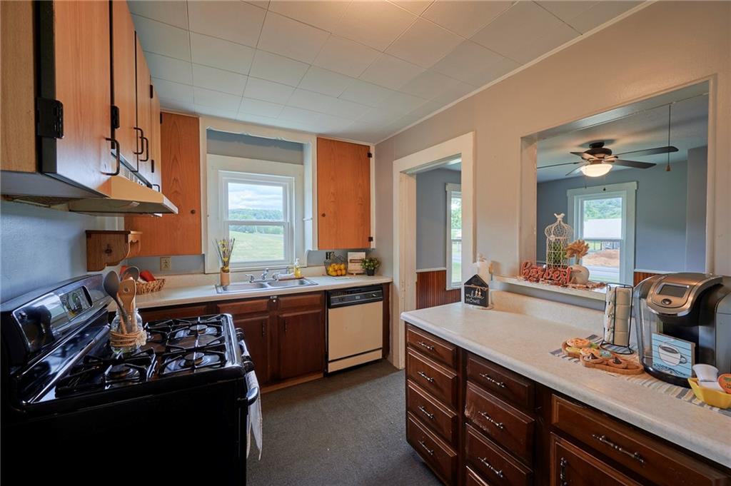 6559 Rte 119 Highway North Marion Center, PA 15759 - Photo 9 of 35 a large kitchen with kitchen island a sink stove and cabinets