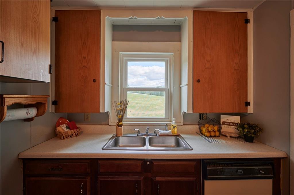 6559 Rte 119 Highway North Marion Center, PA 15759 - Photo 10 of 35 a kitchen with a sink cabinets and a window