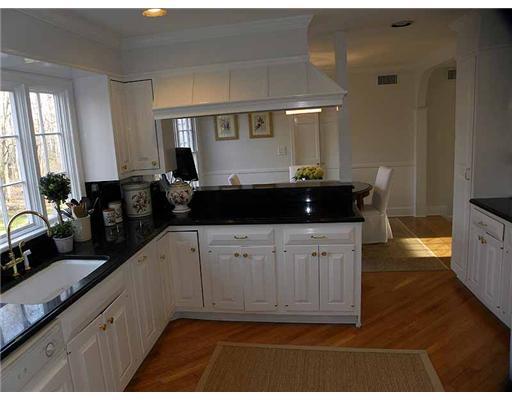 15 Pilgrim Road Darien, CT 06820 - Photo 5 of 20 a kitchen with a sink and cabinets