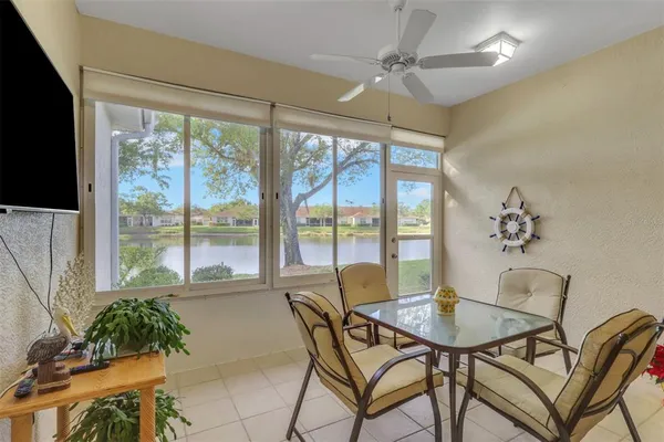 a view of a dining room with furniture window and outside view