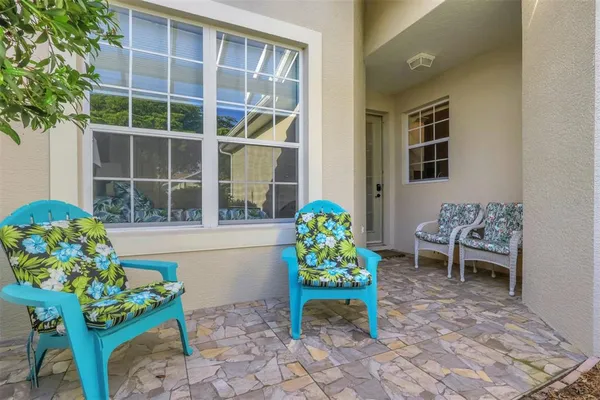 a front view of a house with outdoor seating