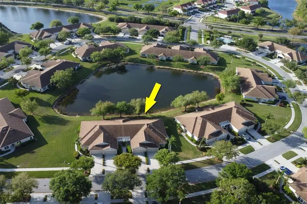 an aerial view of residential house with outdoor space and swimming pool