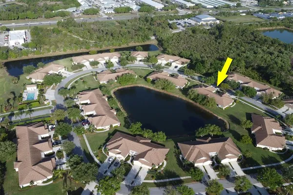 an aerial view of a house with outdoor space