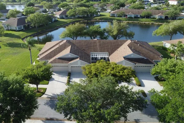 an aerial view of a house with a lake view